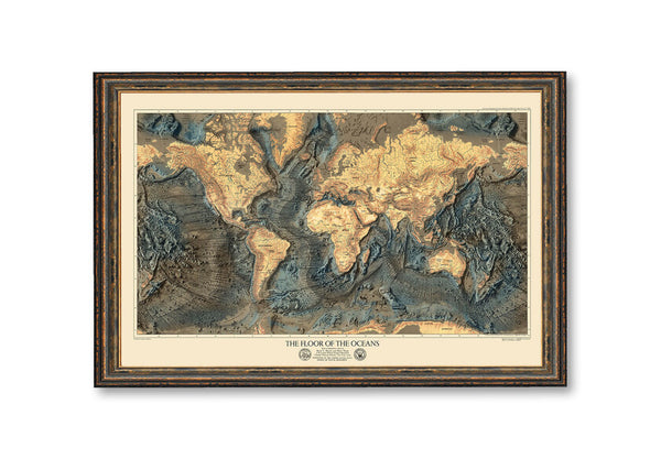 a framed map of the world with mountains